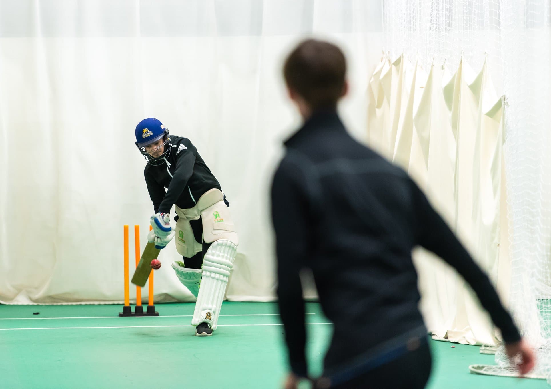 Men playing cricket